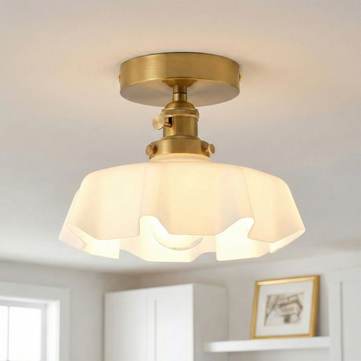 Fleur white scalloped glass semi-flush ceiling light with brass mount, lit
