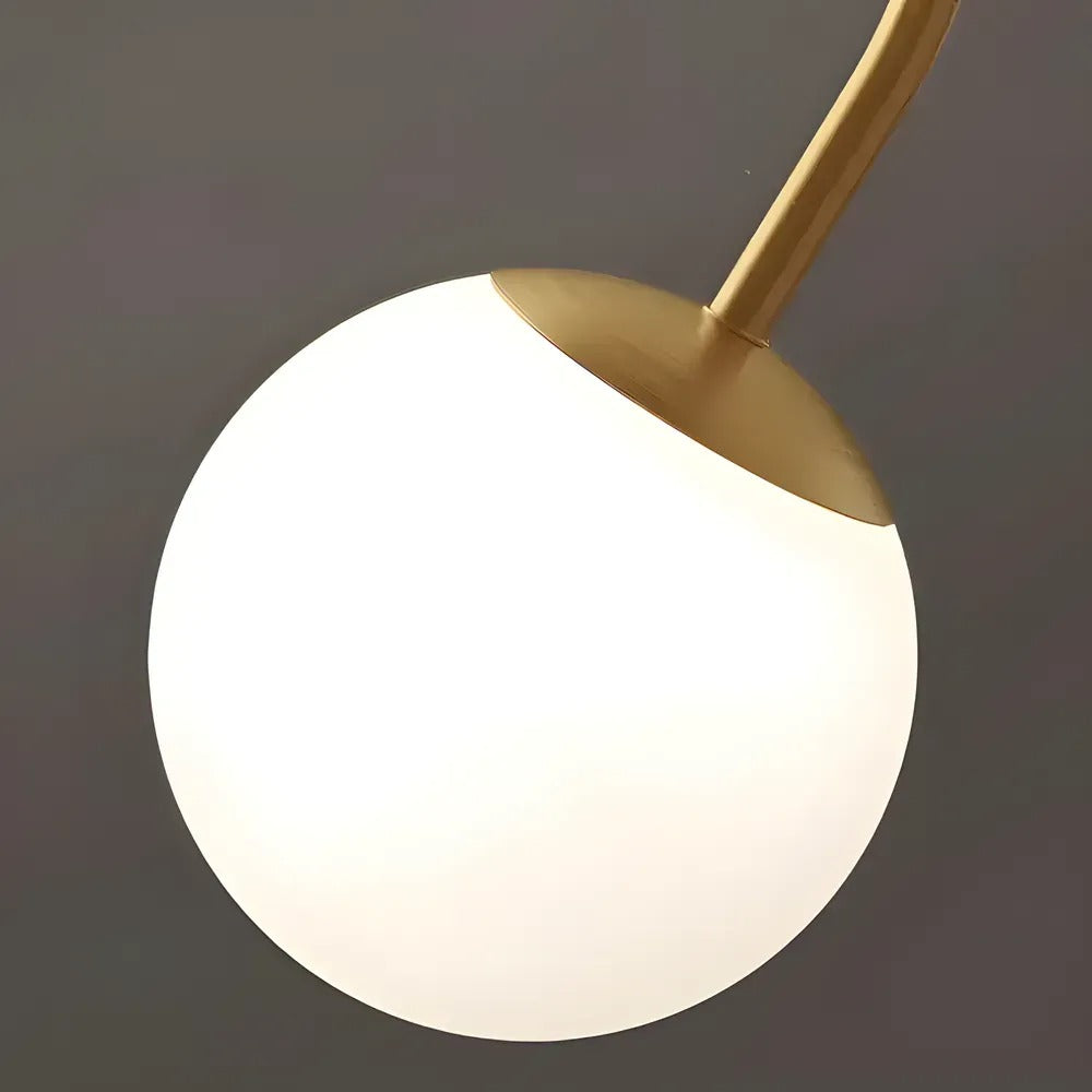 Close-up of the large opal glass globe on the Gemma brass arm