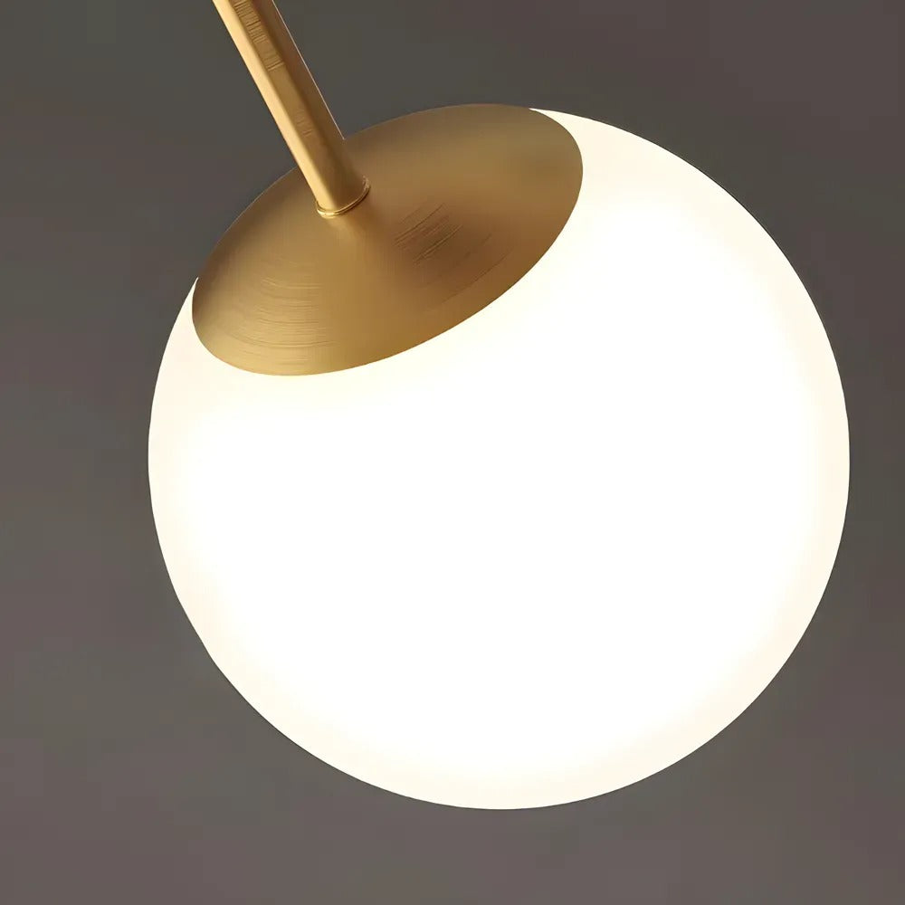 Close-up of the Gemma opal glass globe and brass cap