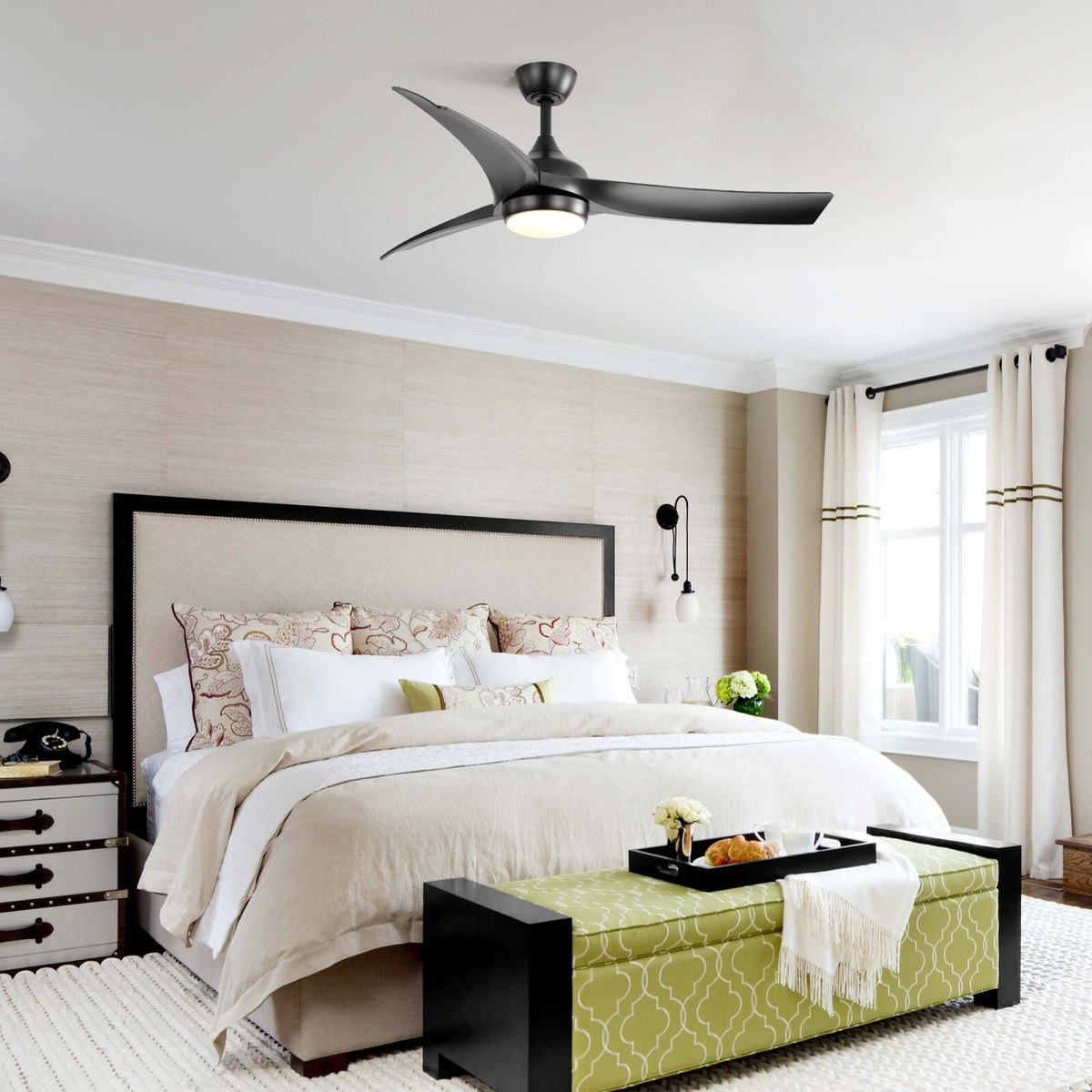 Kestrel black ceiling fan with light above a bed