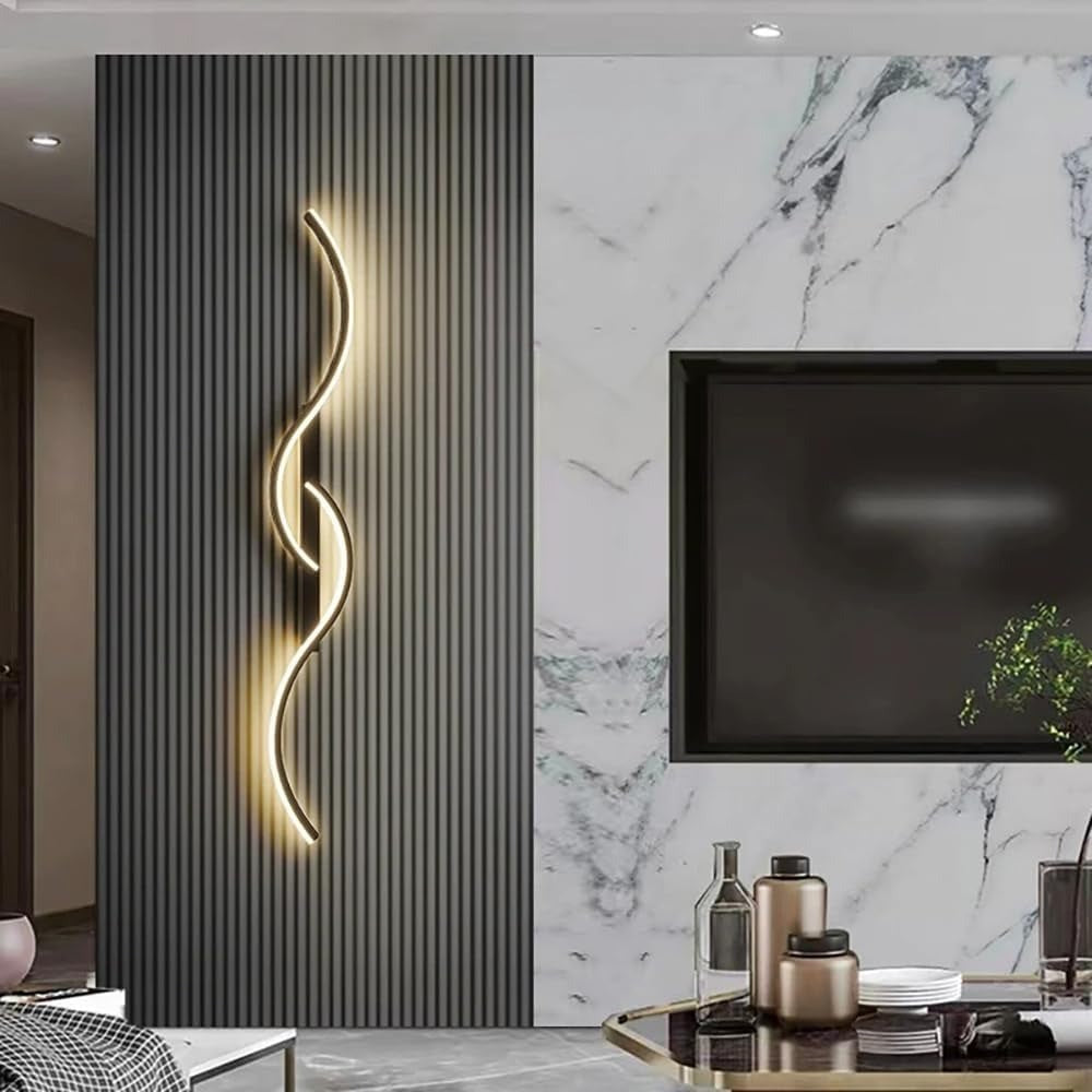 Lyra wave LED wall sconce in black on a slatted feature wall next to a TV