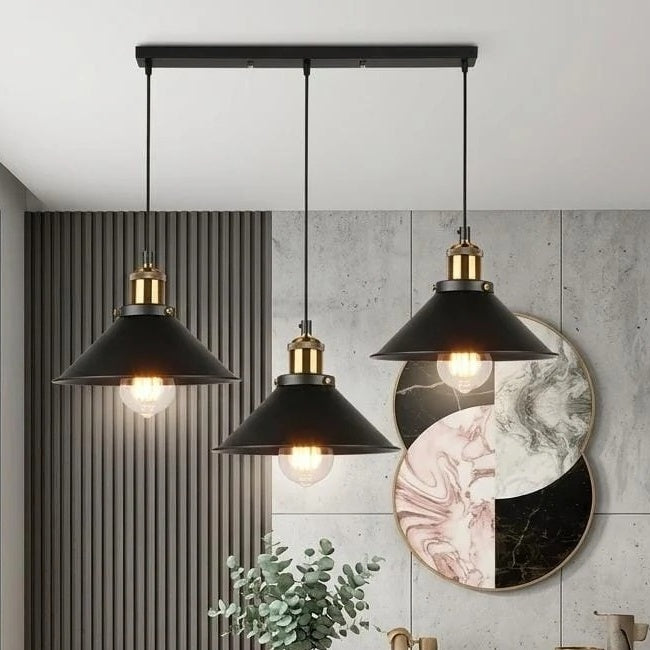 Orrin linear bar 3-light pendant with staggered cone shades in a modern dining room