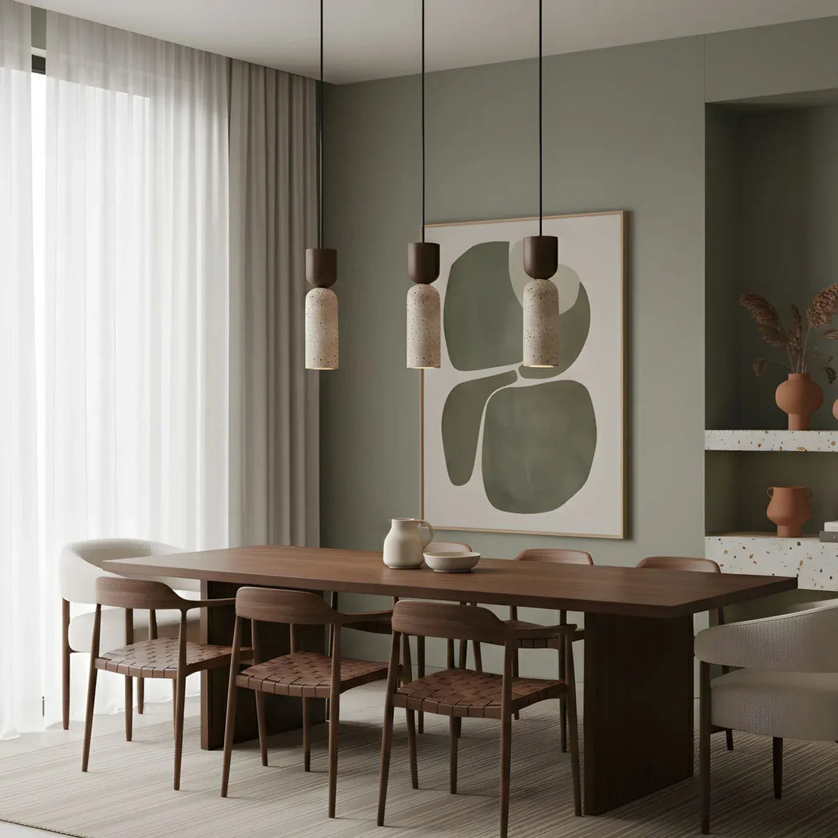 Three Pia travertine mini pendant lights with walnut caps above a wood dining table
