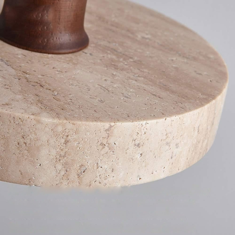 Close-up of Runa travertine stone and walnut detail