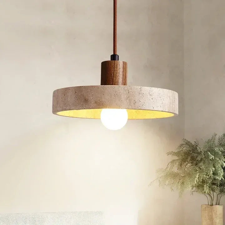 Runa pendant light with a natural travertine disc and walnut wood stem