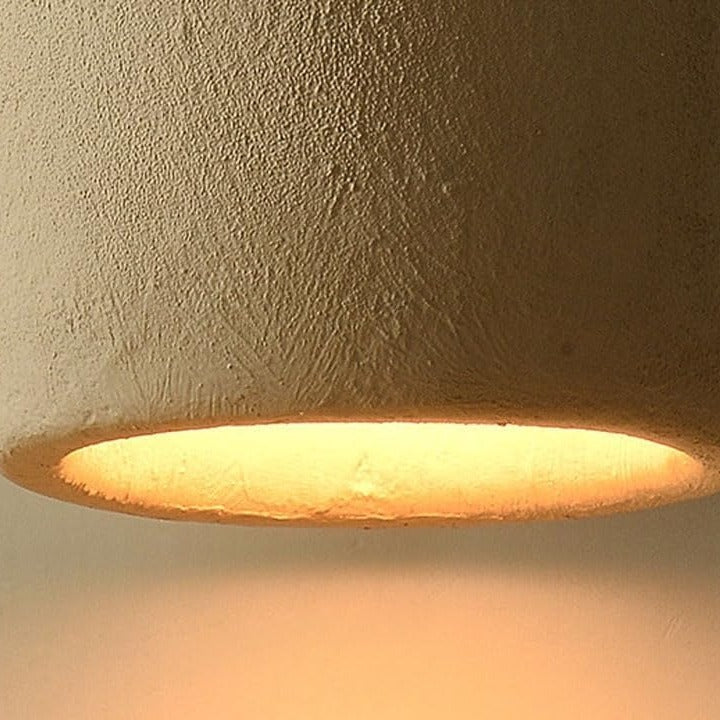 Warm glow under the textured Suna pendant light