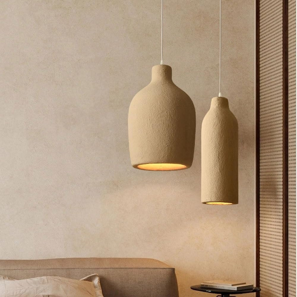 Suna vase and bottle pendant lights above a bed