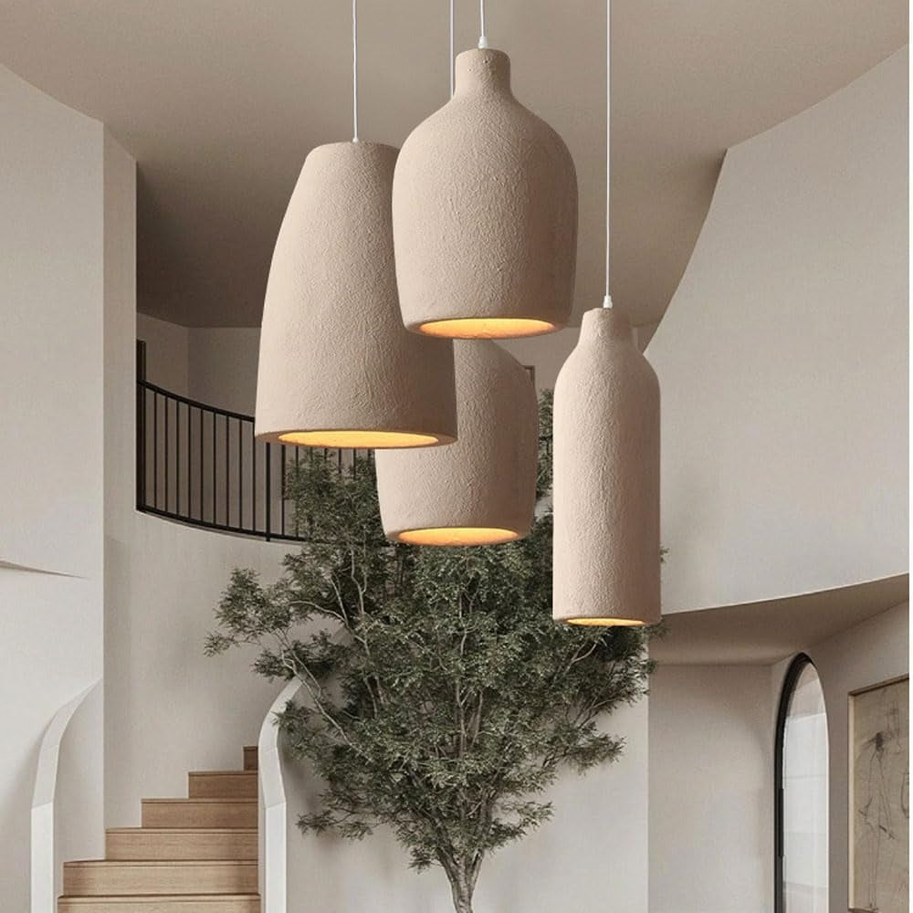 Cluster of Suna wabi-sabi pendant lights in a bright stairwell