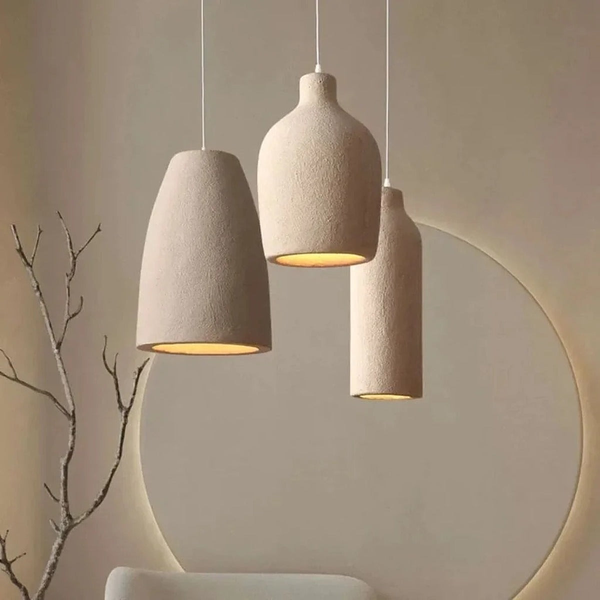 Suna wabi-sabi pendant lights in bottle, vase and dome shapes hanging together