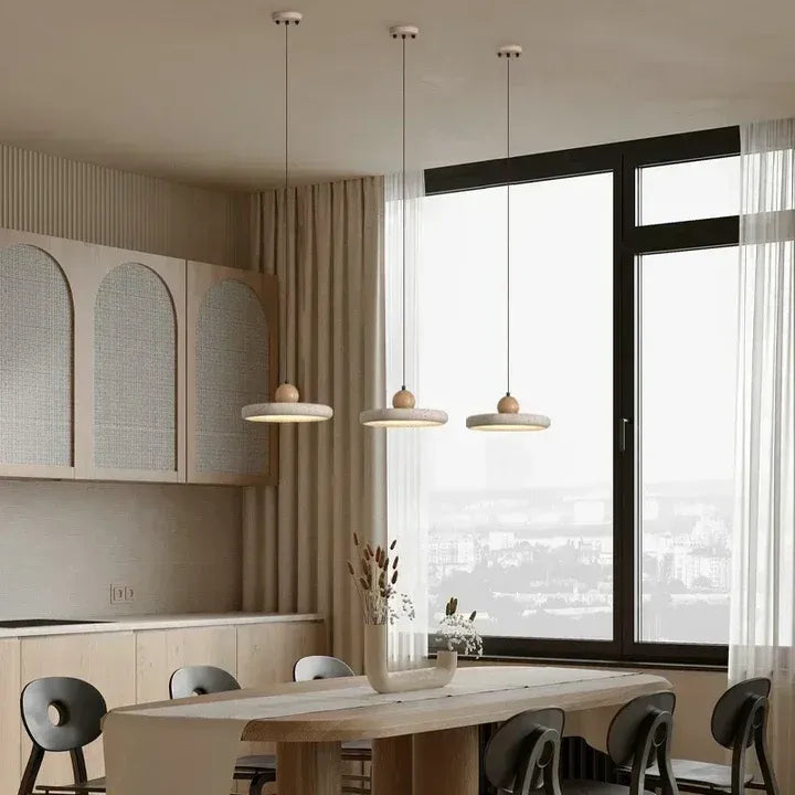 Travertine pendant lights above a kitchen island