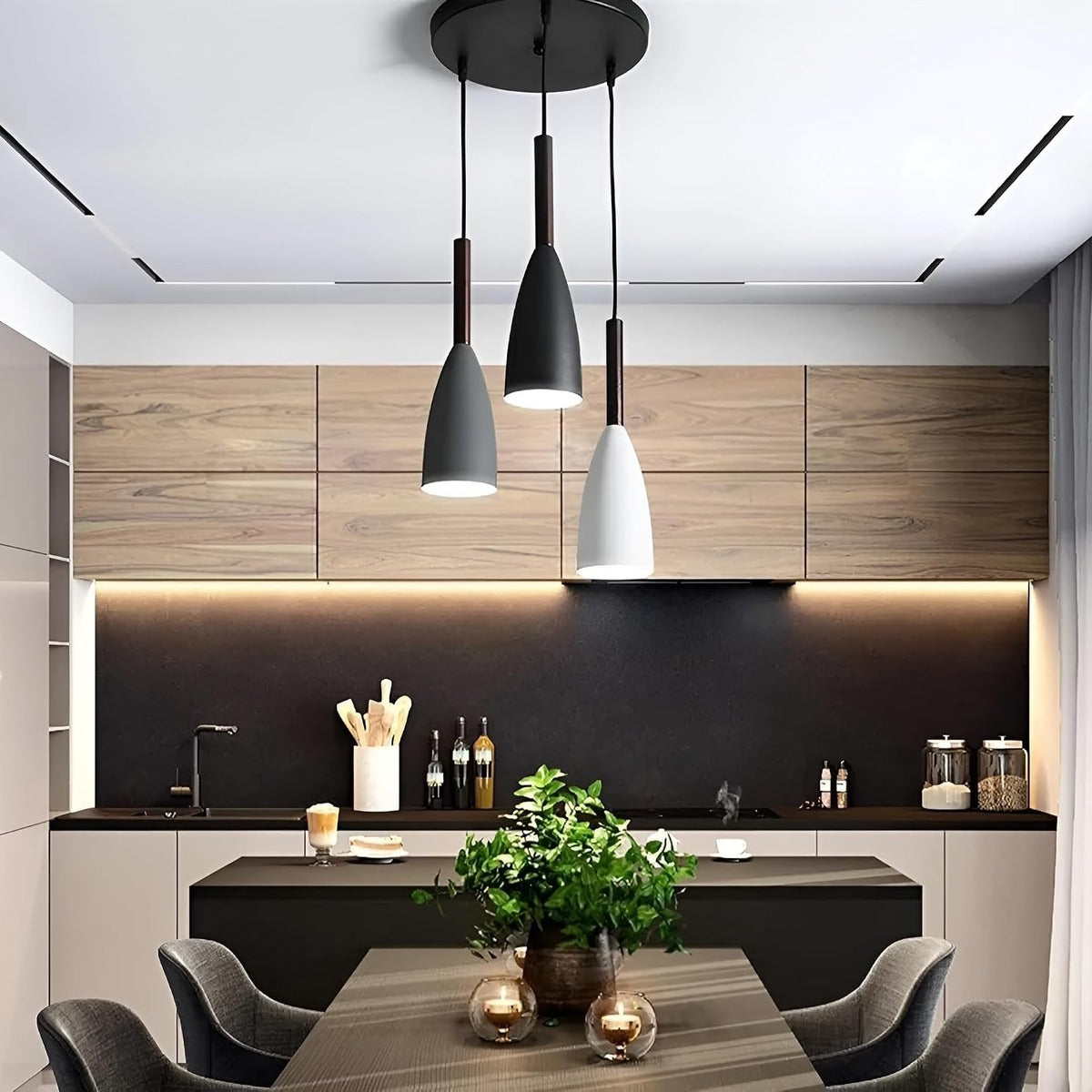 Vika 3-light round pendant in black, white and gray with wood necks over a kitchen dining table