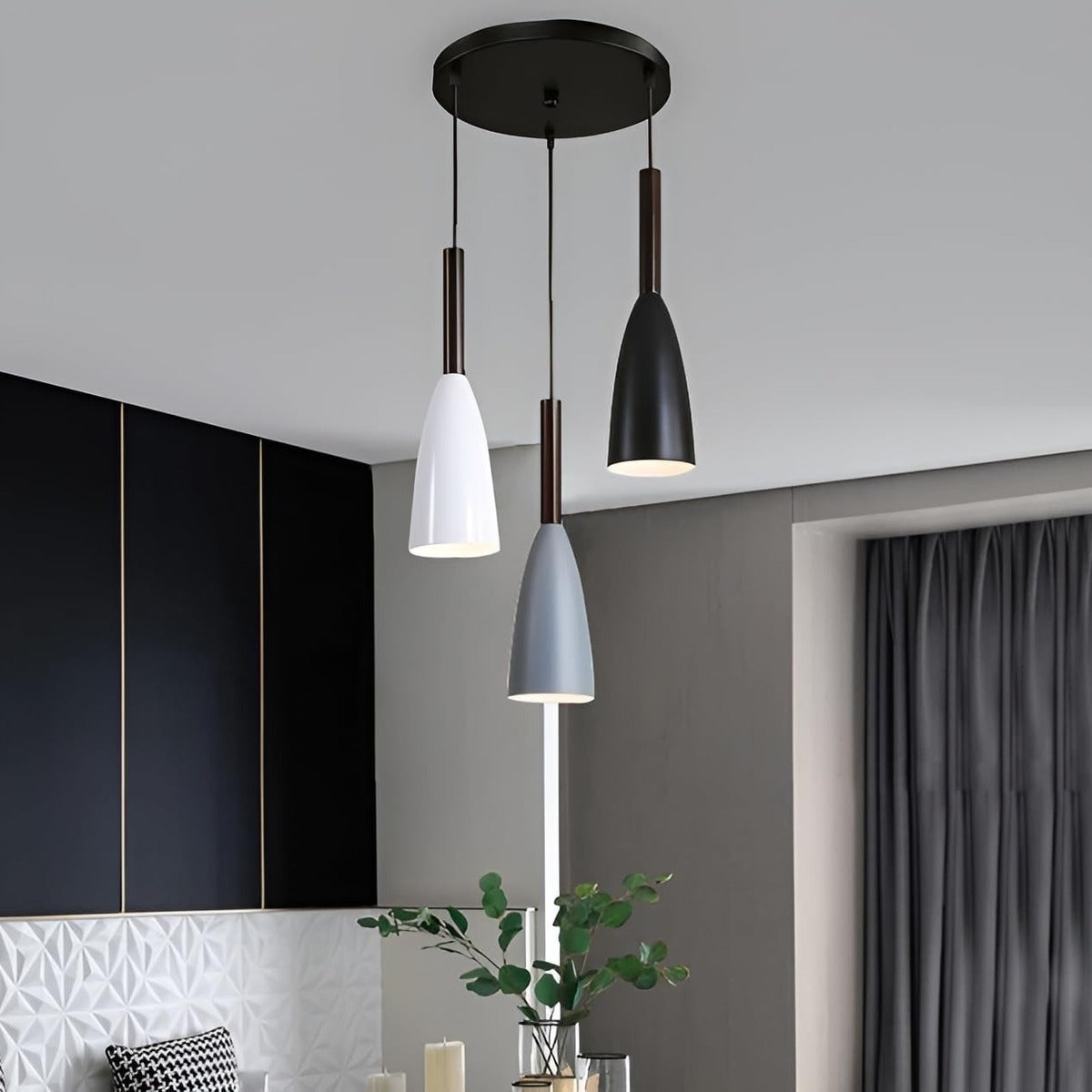 Vika 3-light pendant in white, gray and black in a modern dark-walled interior